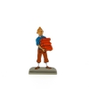Tintin carrying books