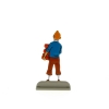 Tintin carrying books