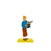 Tintin holding a newspaper