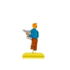 Tintin tenant un journal